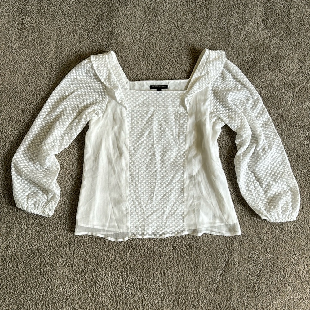 Banana Republic blouse with white polka dot pattern.